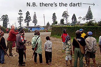 Simon throwing darts